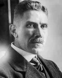 Papen in a suit and tie, looking stern and formal